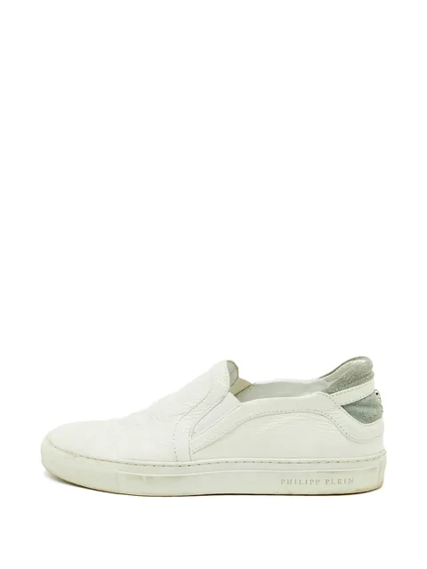 skull-embossed slip-on sneakers