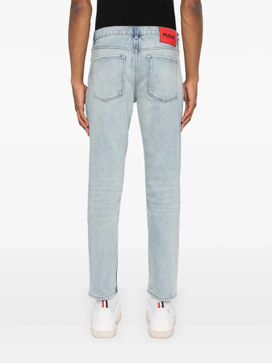 slim-leg cotton-blend jeans 8
