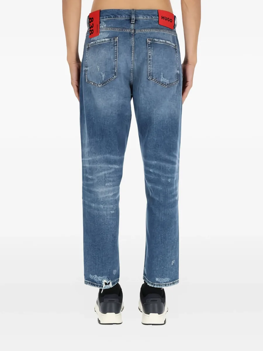 distressed-details logo-patch jeans 7
