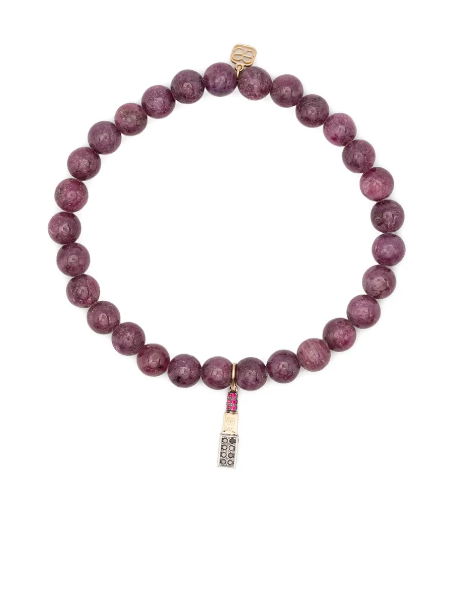 14CT yellow gold diamond and ruby charm bracelet 1