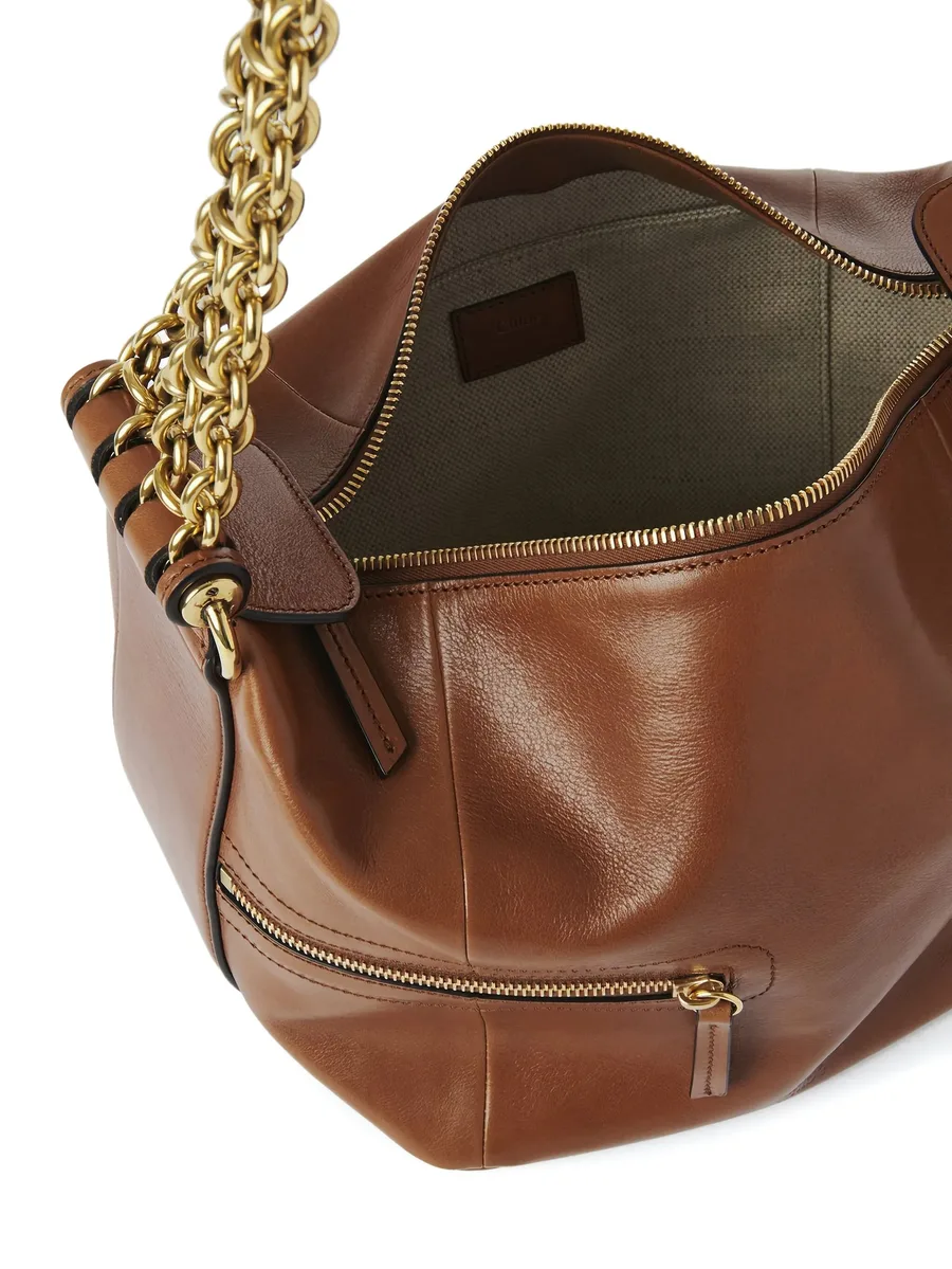 chain-trimmed leather bag 8