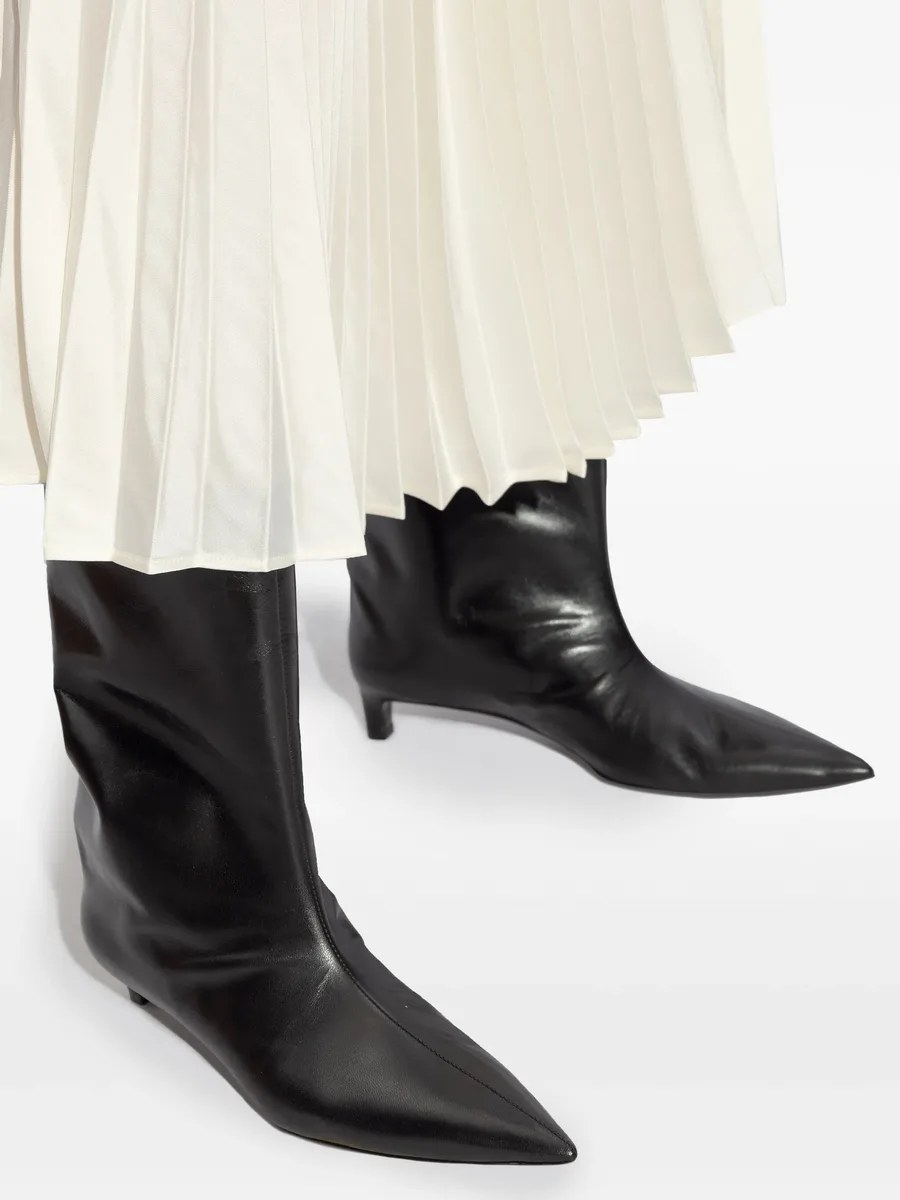 pointed-toe leather boots 12