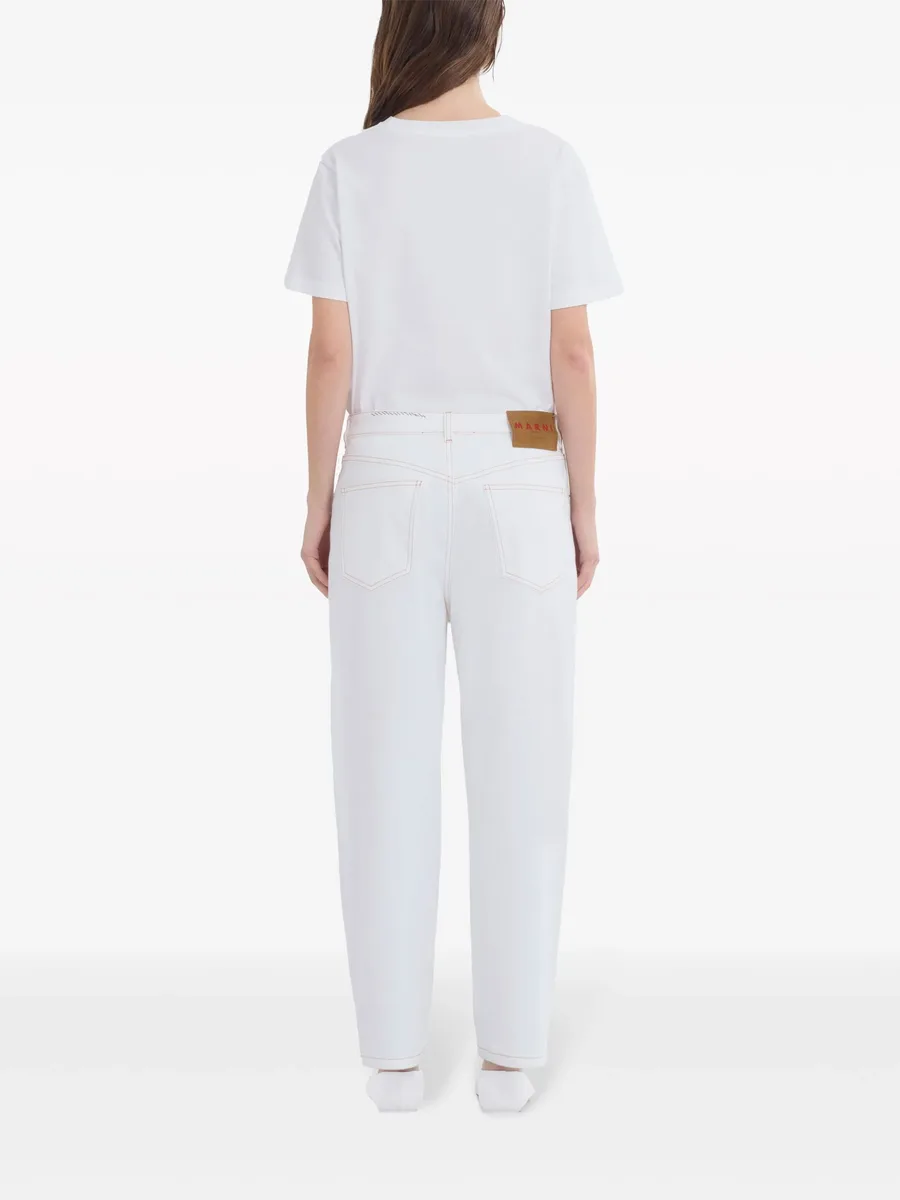 appliquéd tapered jeans 7