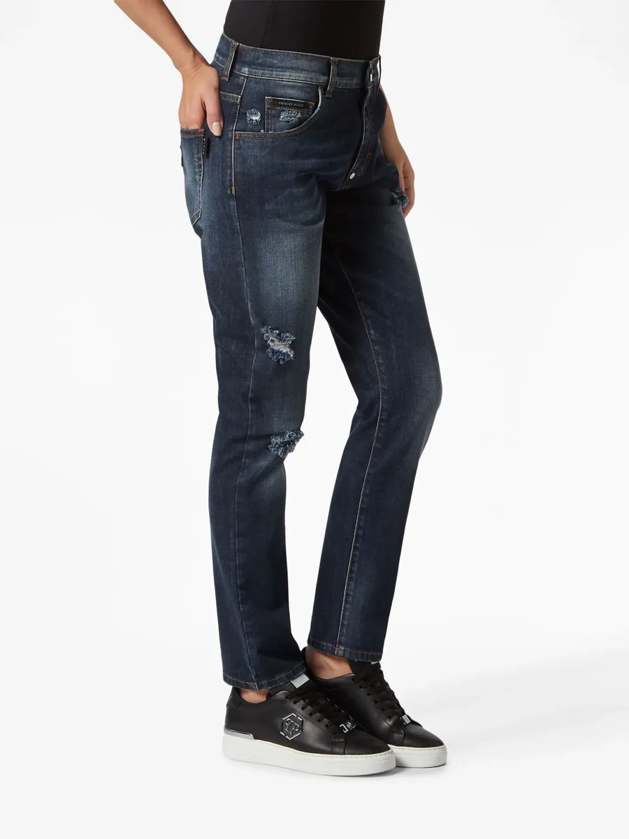 distressed-effect denim trousers 6
