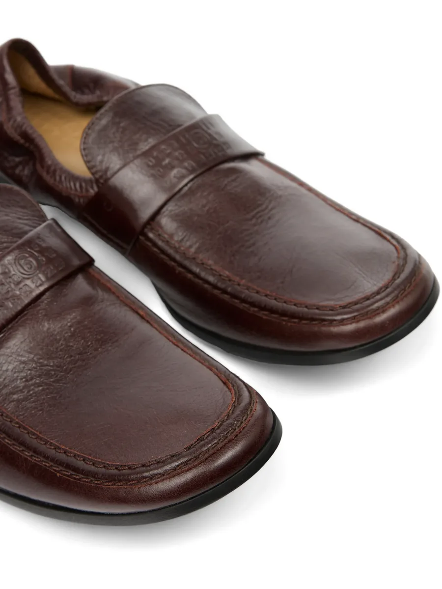 Swing-toe leather loafers 8