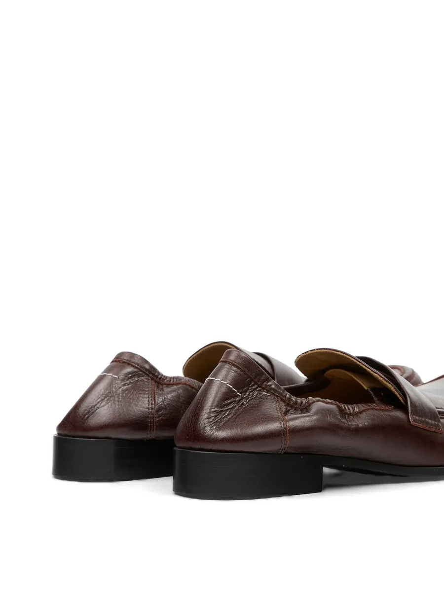 Swing-toe leather loafers 10
