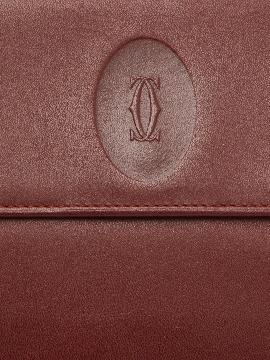 кошелек Le Must de Cartier с тисненым логотипом 9