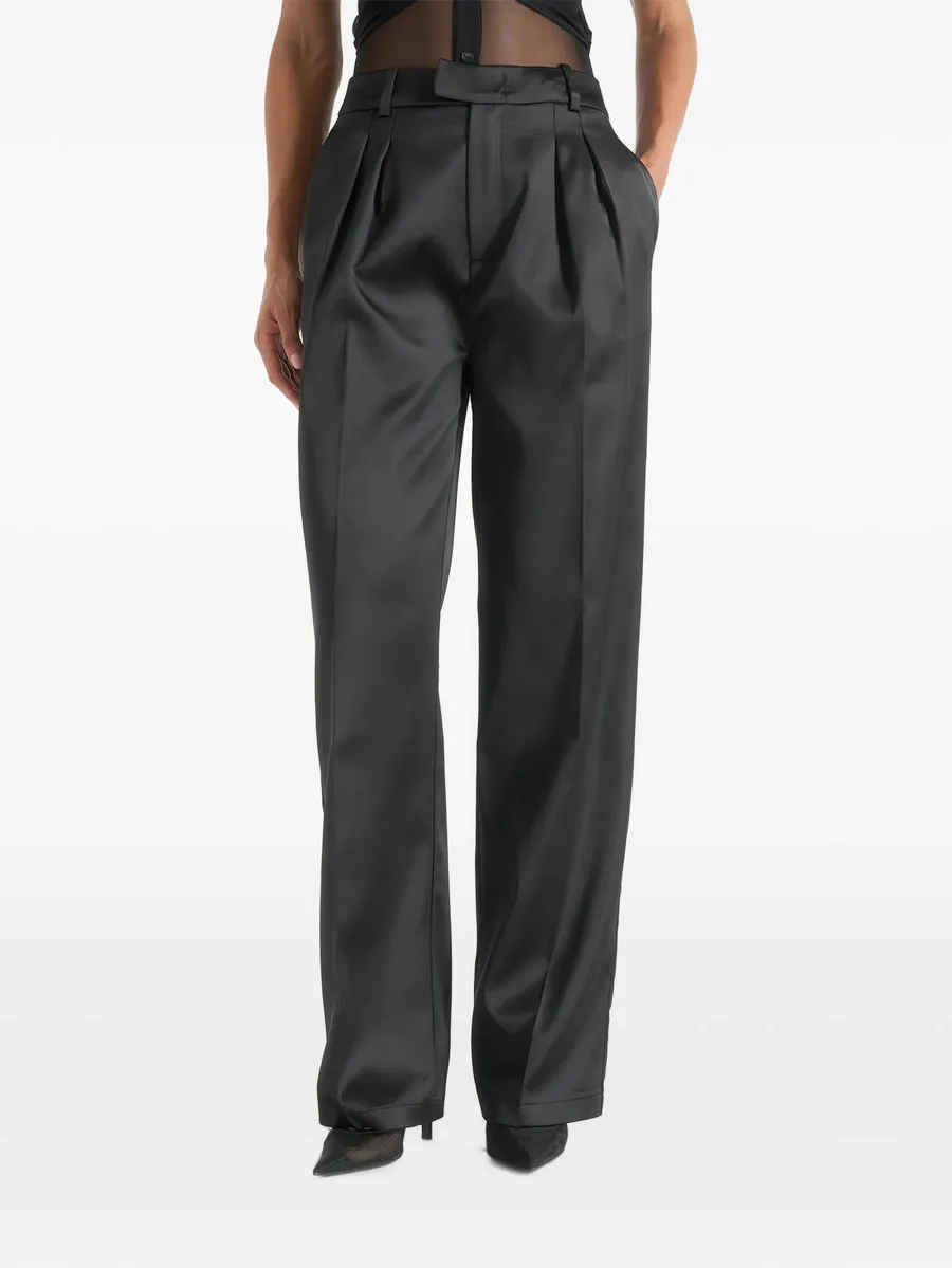 Julie in black satin twin-pleat trousers 1