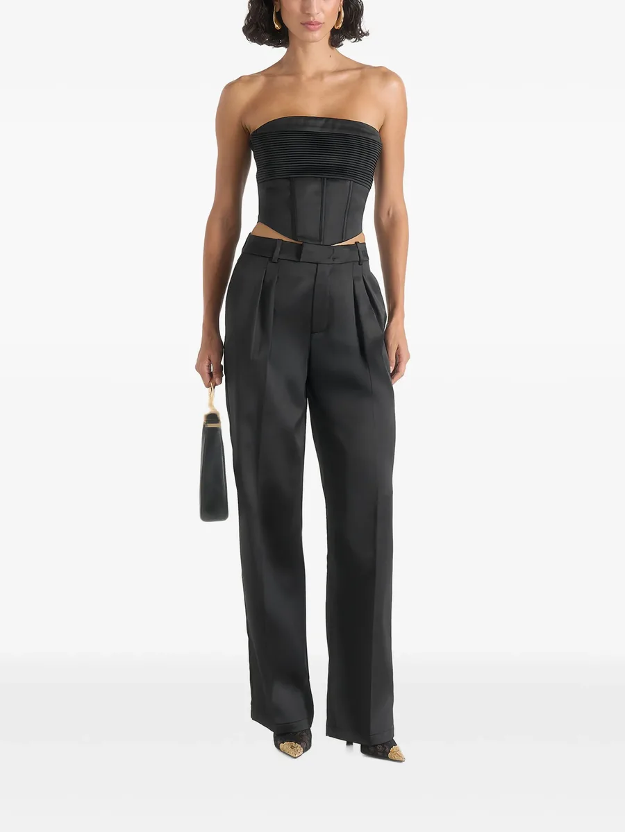 Julie in black satin twin-pleat trousers 2