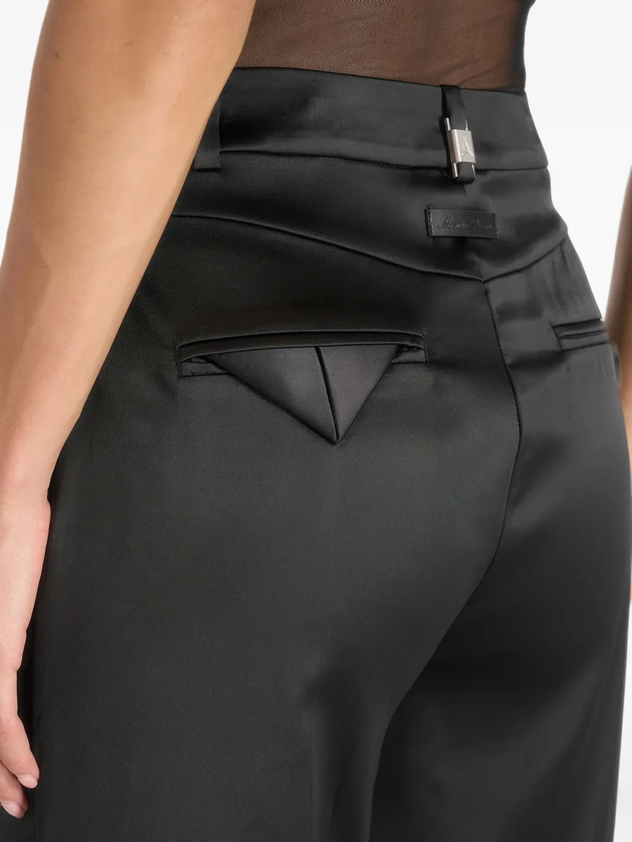 Julie in black satin twin-pleat trousers 4