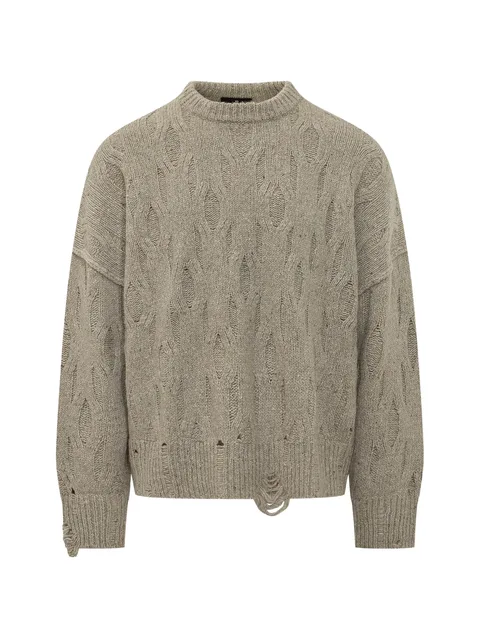 distressed cable-knit sweater