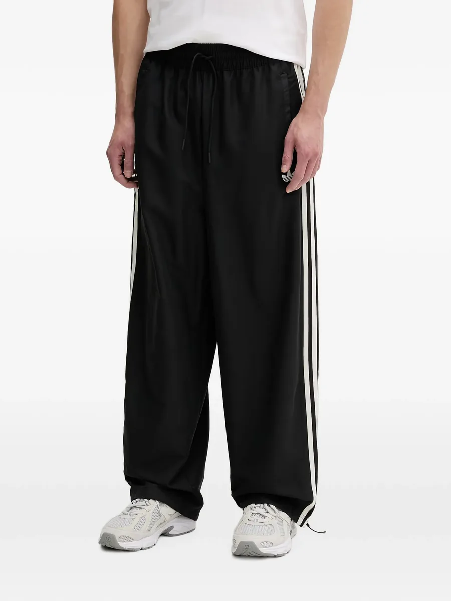 Windbreaker side-stripe track pants 1